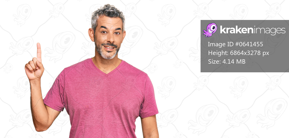 Middle age grey-haired man wearing casual clothes pointing finger up with successful idea. exited and happy. number one. 