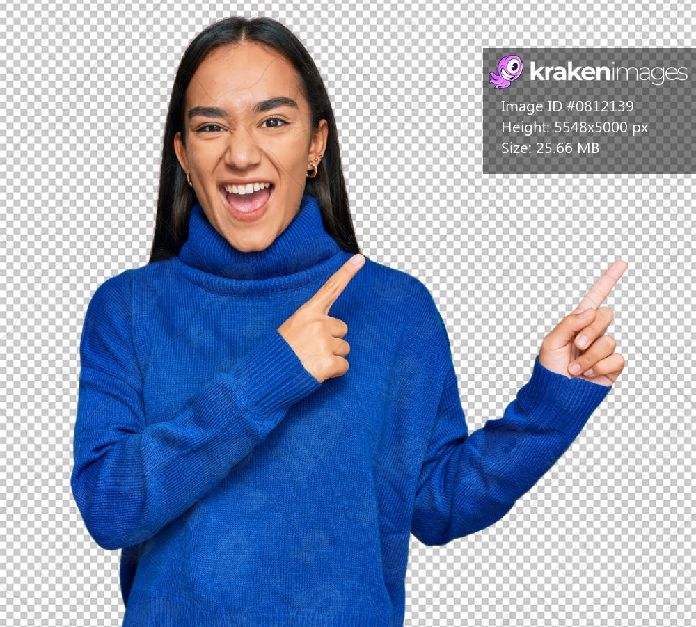 Young asian woman wearing casual winter sweater smiling and looking at the camera pointing with two hands and fingers to the side.