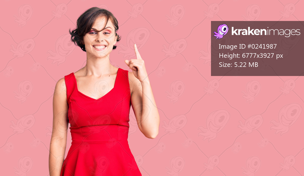 Beautiful young woman with short hair wearing casual style with sleeveless shirt showing and pointing up with finger number one while smiling confident and happy. 