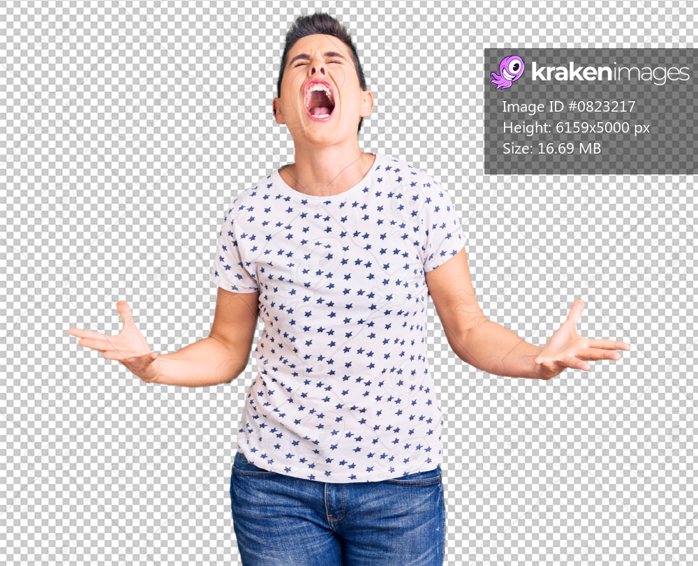 Young woman with short hair wearing casual clothes crazy and mad shouting and yelling with aggressive expression and arms raised. frustration concept.