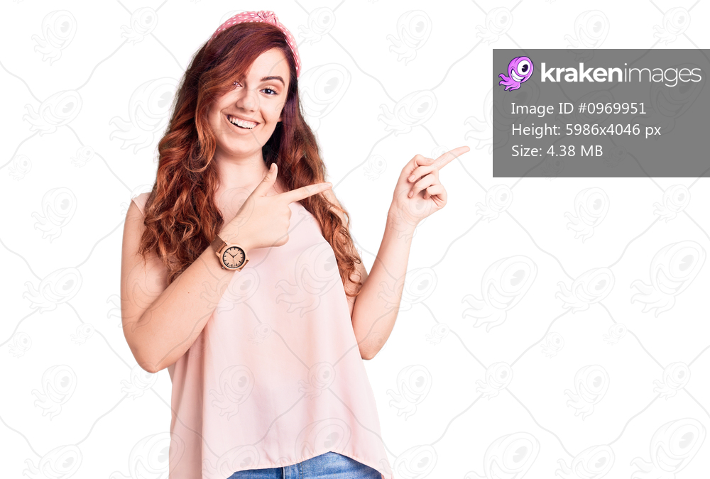 Young beautiful woman wearing casual clothes and diadem smiling and looking at the camera pointing with two hands and fingers to the side. 