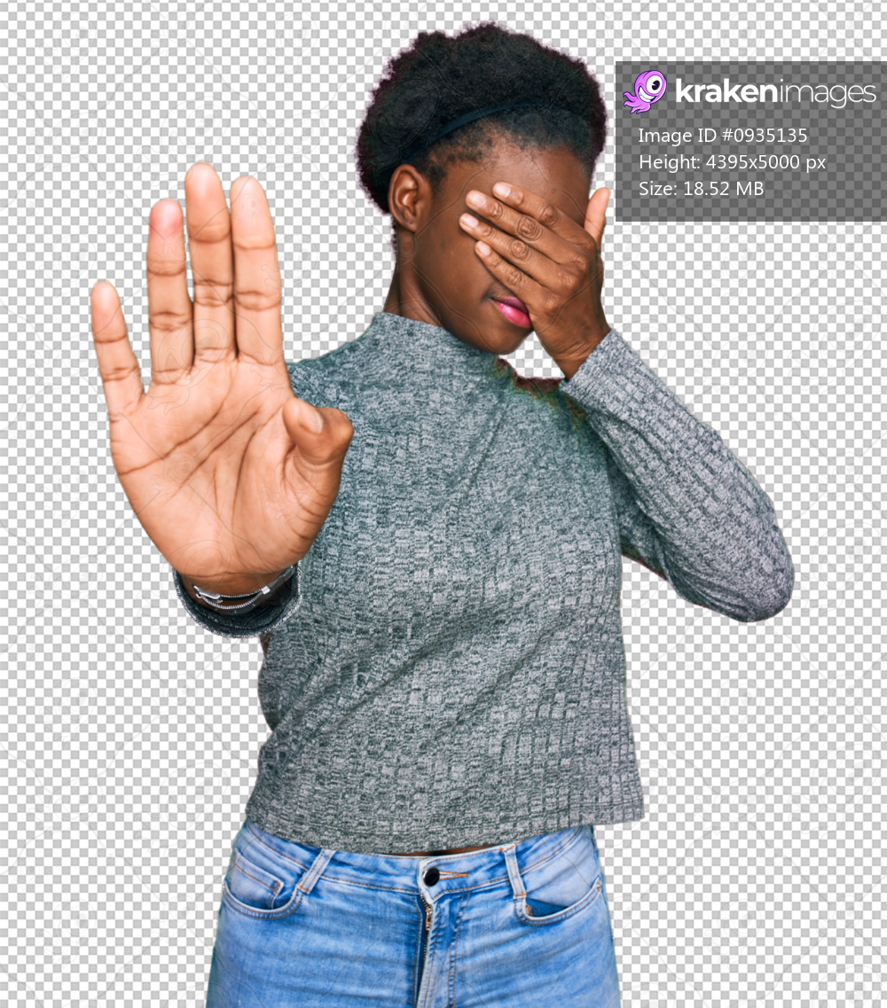 Young african american girl wearing casual clothes covering eyes with hands and doing stop gesture with sad and fear expression. embarrassed and negative concept.