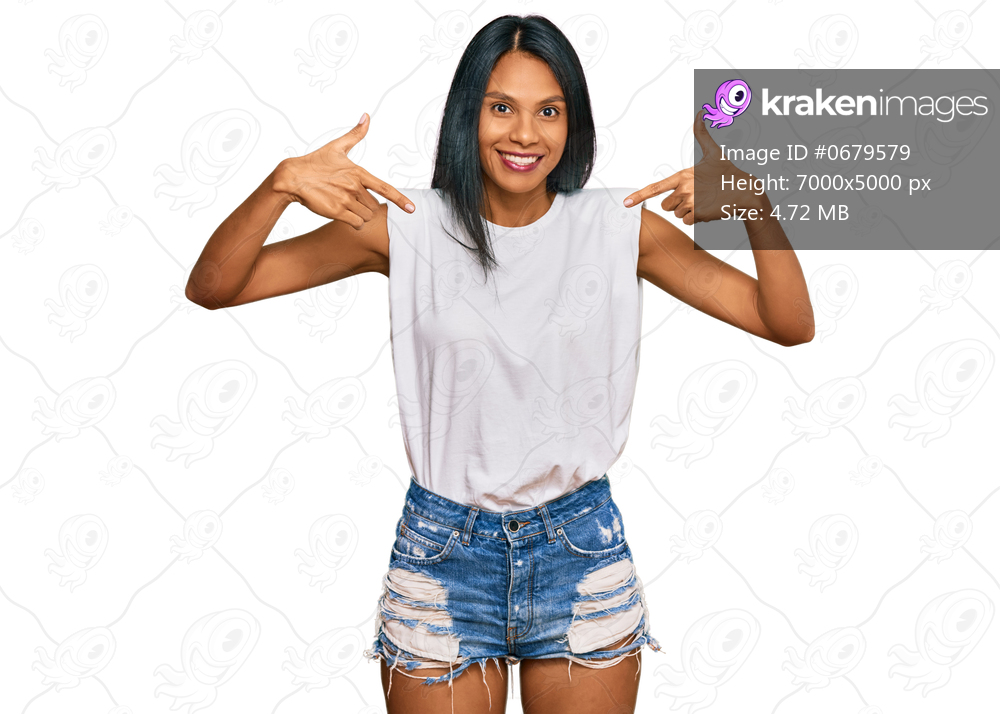 Young african american woman wearing casual clothes looking confident with smile on face, pointing oneself with fingers proud and happy. 