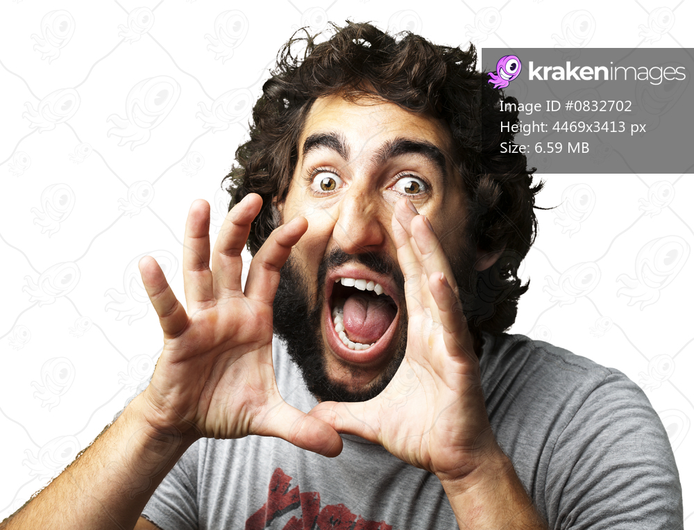 portrait of young man screaming against a white background
