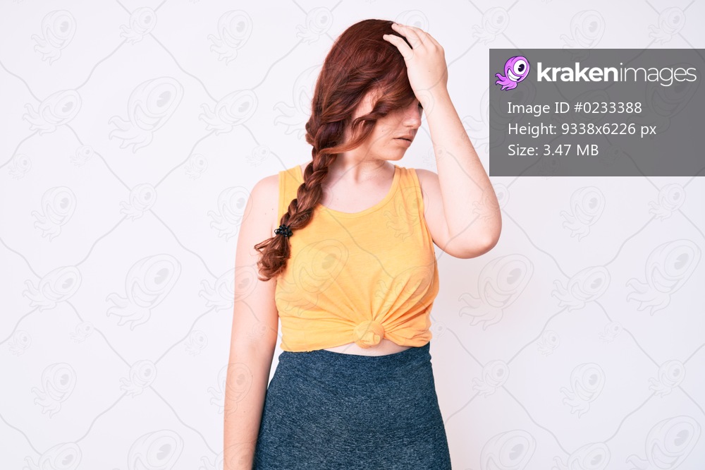 Young beautiful woman wearing casual clothes surprised with hand on head for mistake, remember error. forgot, bad memory concept. 