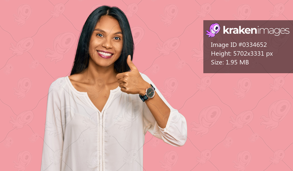 Young african american woman wearing casual clothes smiling happy and positive, thumb up doing excellent and approval sign 