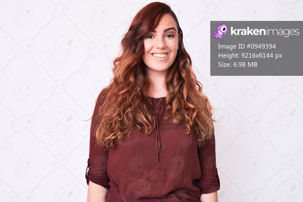 Young beautiful woman wearing casual clothes looking positive and happy standing and smiling with a confident smile showing teeth 