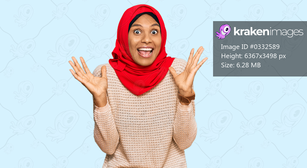 Young african american woman wearing traditional islamic hijab scarf celebrating crazy and amazed for success with arms raised and open eyes screaming excited. winner concept 