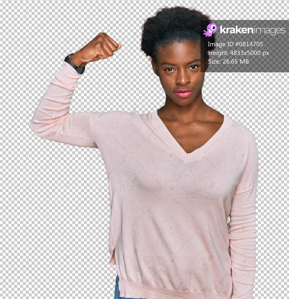 Young african american girl wearing casual clothes strong person showing arm muscle, confident and proud of power