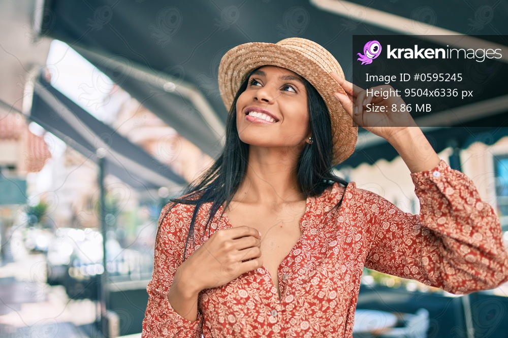 Young african american tourist woman on vacation smiling happy walking at the city.