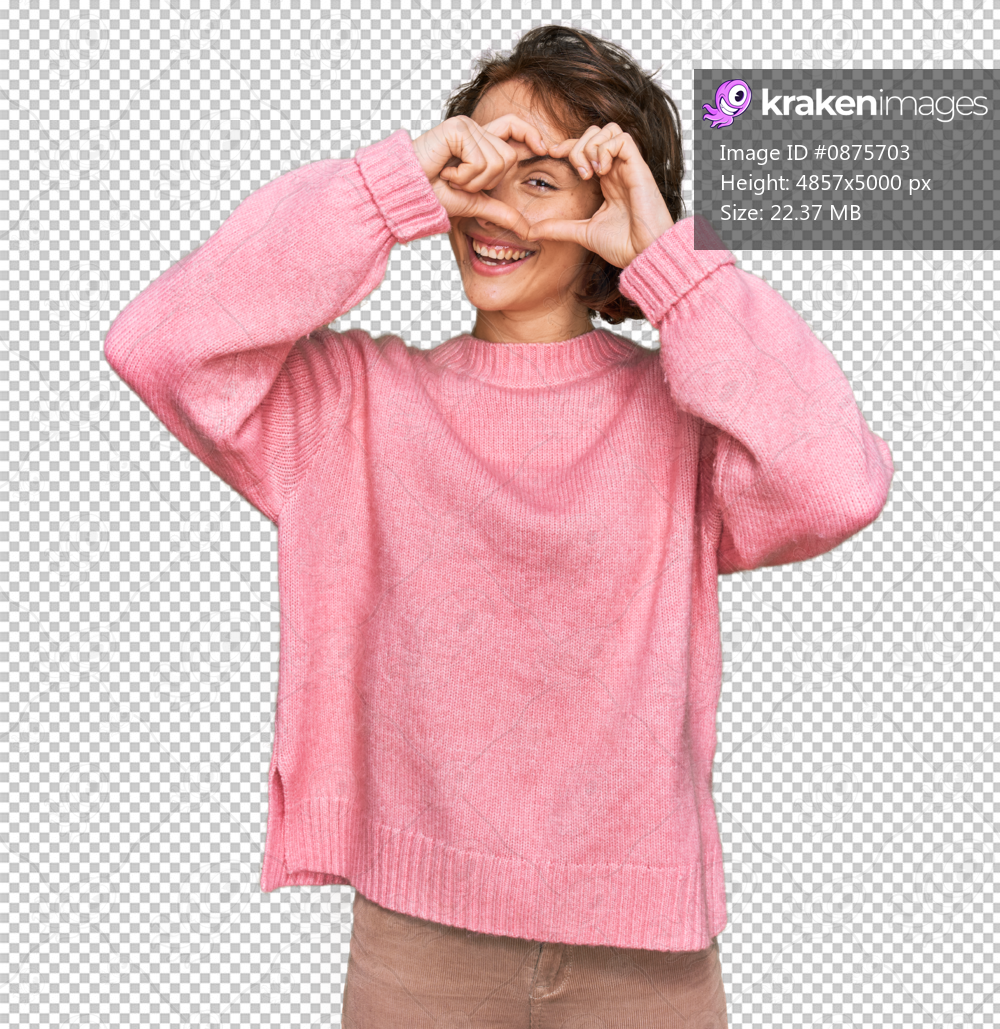 Young hispanic woman wearing casual clothes doing heart shape with hand and fingers smiling looking through sign