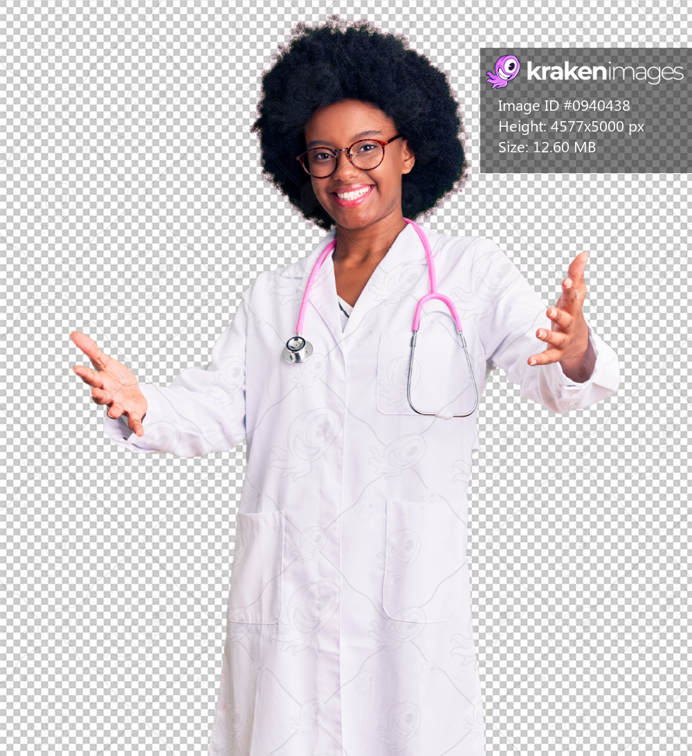 Young african american woman wearing doctor coat and stethoscope looking at the camera smiling with open arms for hug. cheerful expression embracing happiness.