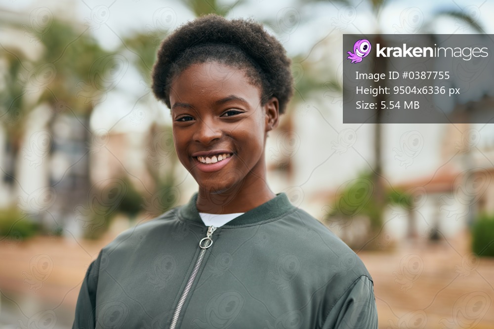 Young african american girl smiling happy standing at the park.