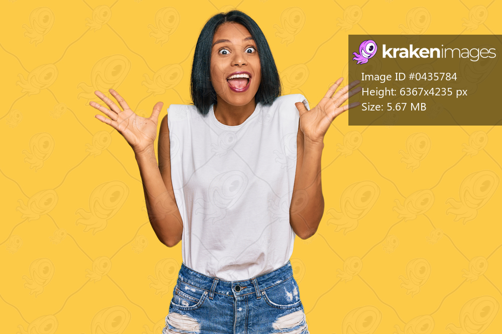 Young african american woman wearing casual clothes celebrating crazy and amazed for success with arms raised and open eyes screaming excited. winner concept 