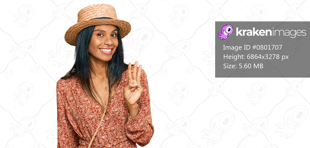 Young african american woman wearing summer hat showing and pointing up with fingers number three while smiling confident and happy. 