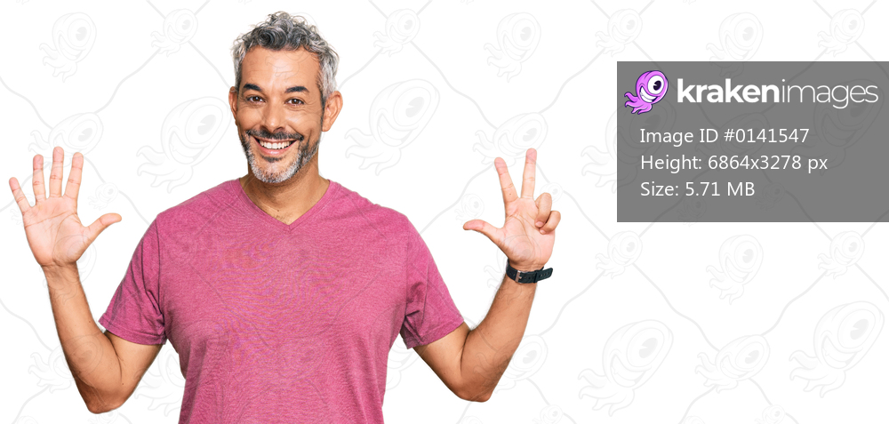 Middle age grey-haired man wearing casual clothes showing and pointing up with fingers number eight while smiling confident and happy. 