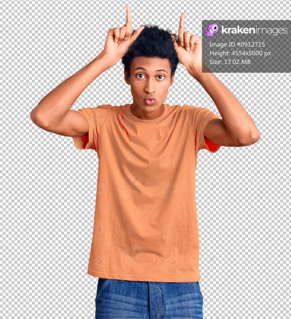 Young african american man wearing casual clothes doing funny gesture with finger over head as bull horns