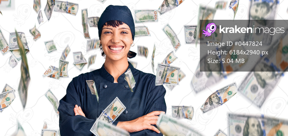 Young brunette woman with short hair wearing professional cook uniform happy face smiling with crossed arms looking at the camera. positive person.
