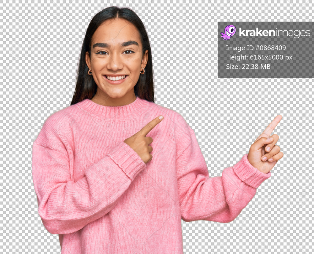 Young asian woman wearing casual winter sweater smiling and looking at the camera pointing with two hands and fingers to the side.