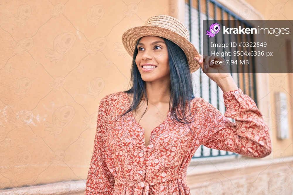 Young african american tourist woman on vacation smiling happy walking at the city.