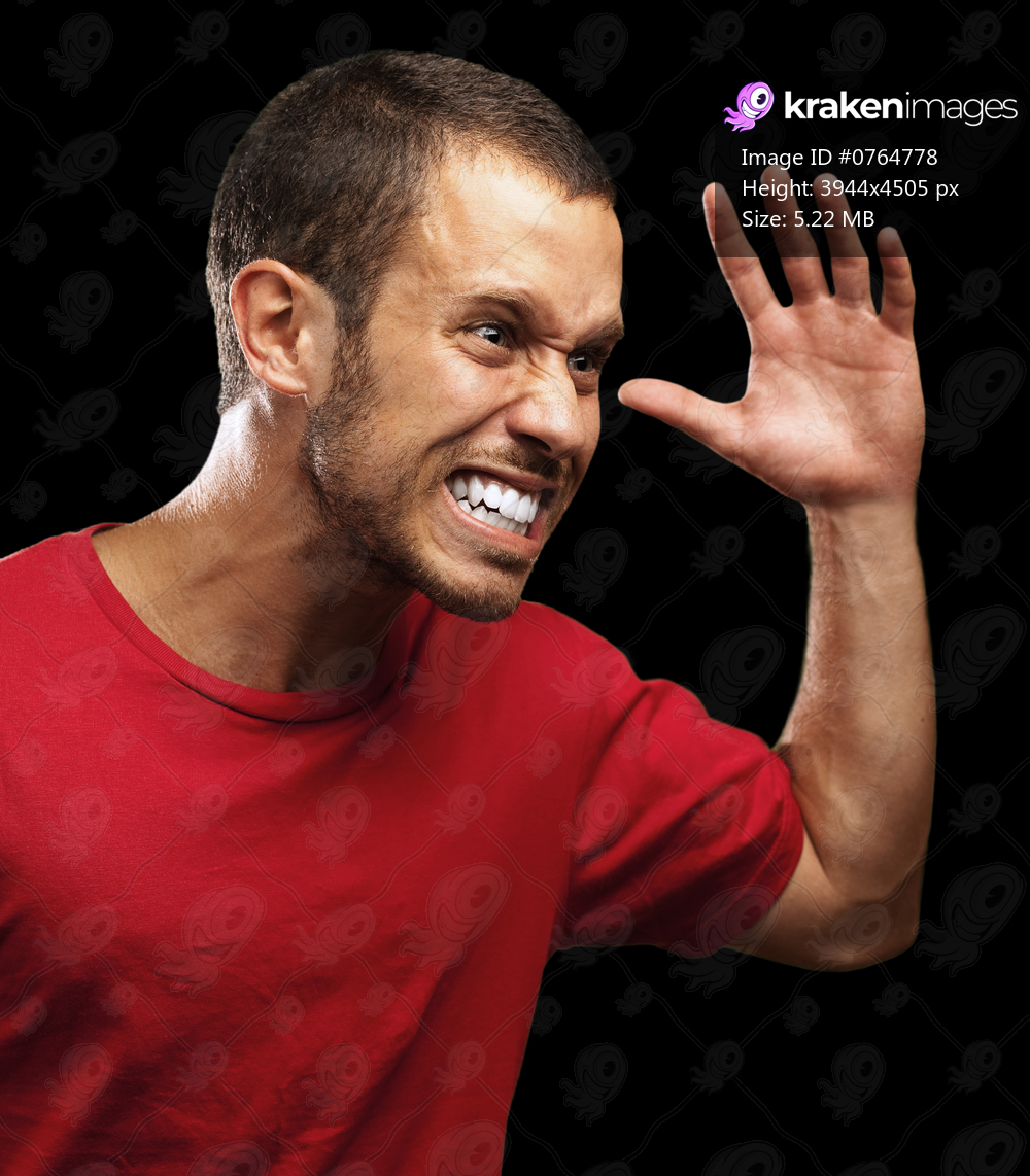 young furious man on a black background