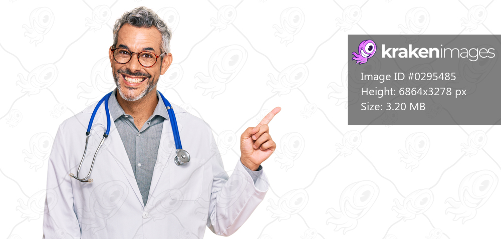 Middle age grey-haired man wearing doctor uniform and stethoscope smiling happy pointing with hand and finger to the side 