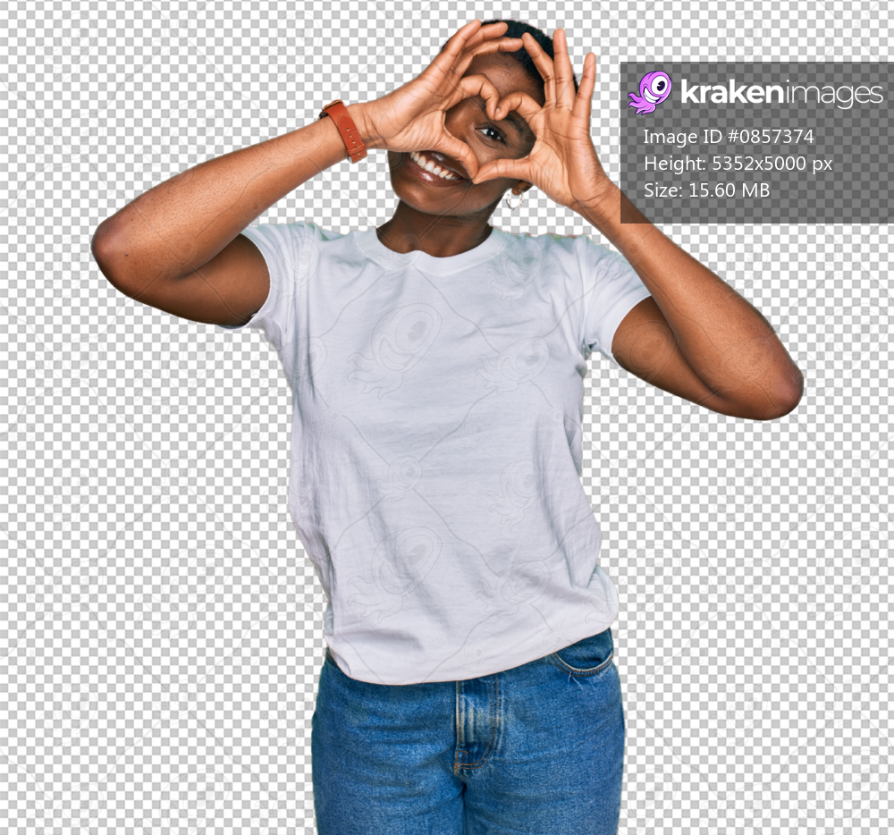 Young african american woman wearing casual white t shirt doing heart shape with hand and fingers smiling looking through sign