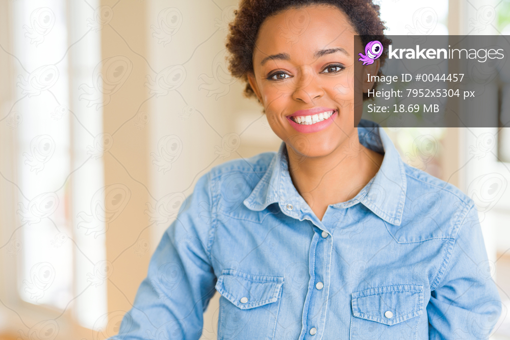 Young beautiful african american woman with a happy and cool smile on face. Lucky person.