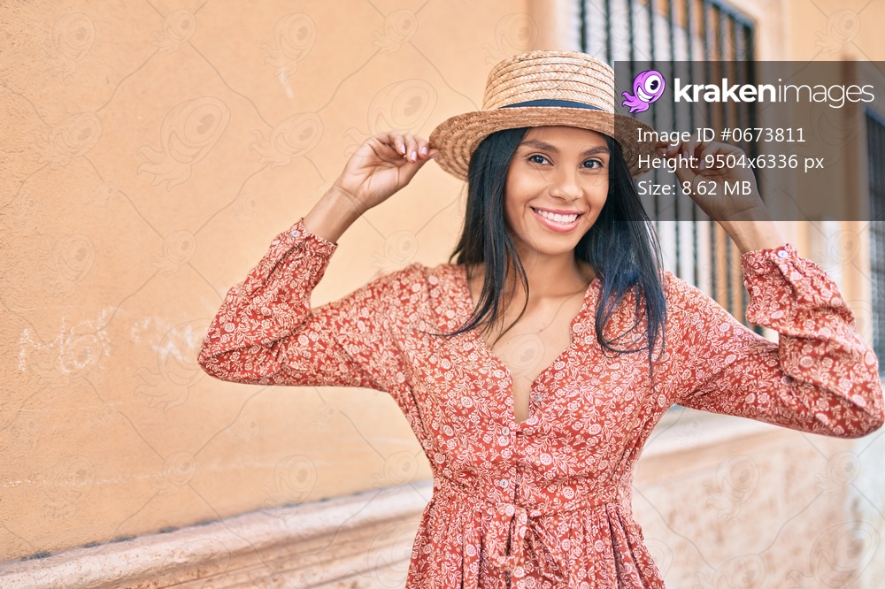 Young african american tourist woman on vacation smiling happy walking at the city.