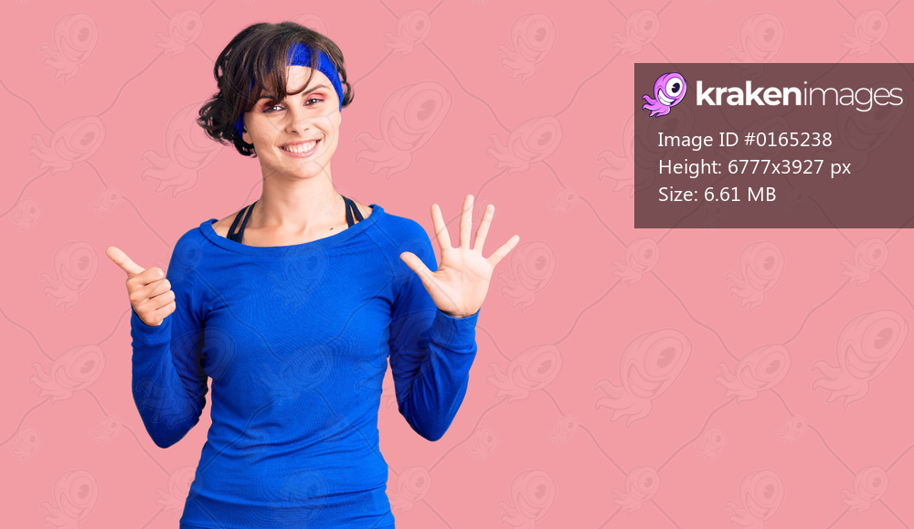 Beautiful young woman with short hair wearing training workout clothes showing and pointing up with fingers number six while smiling confident and happy. 