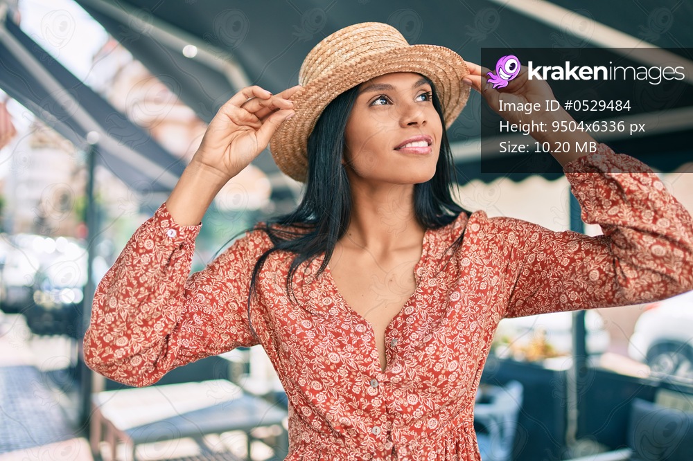 Young african american tourist woman on vacation smiling happy walking at the city.