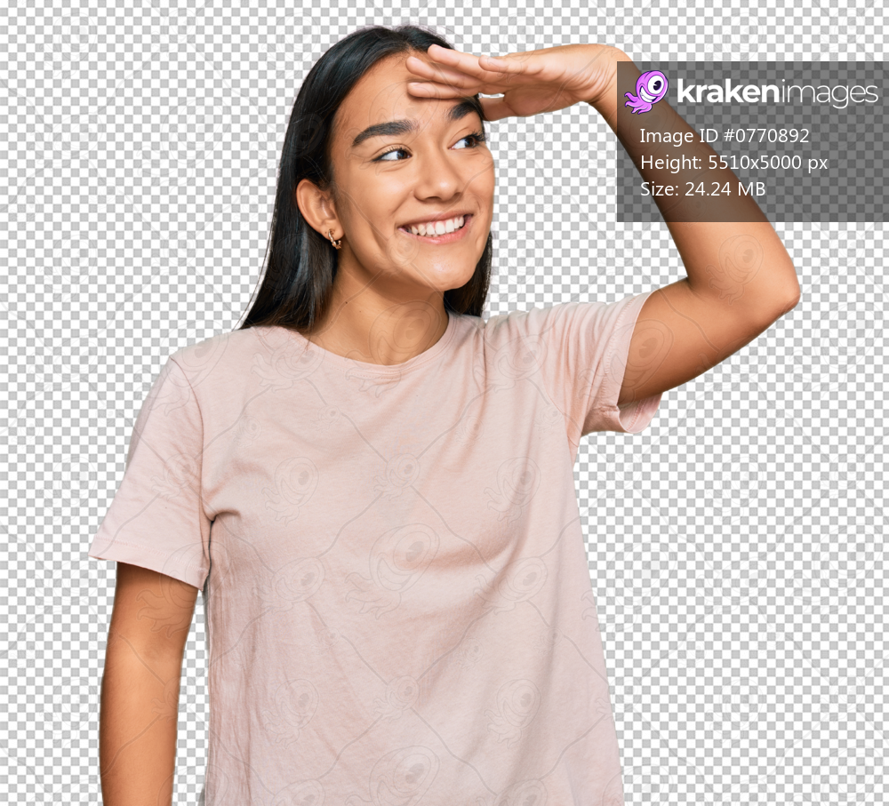 Young asian woman wearing casual clothes very happy and smiling looking far away with hand over head. searching concept.