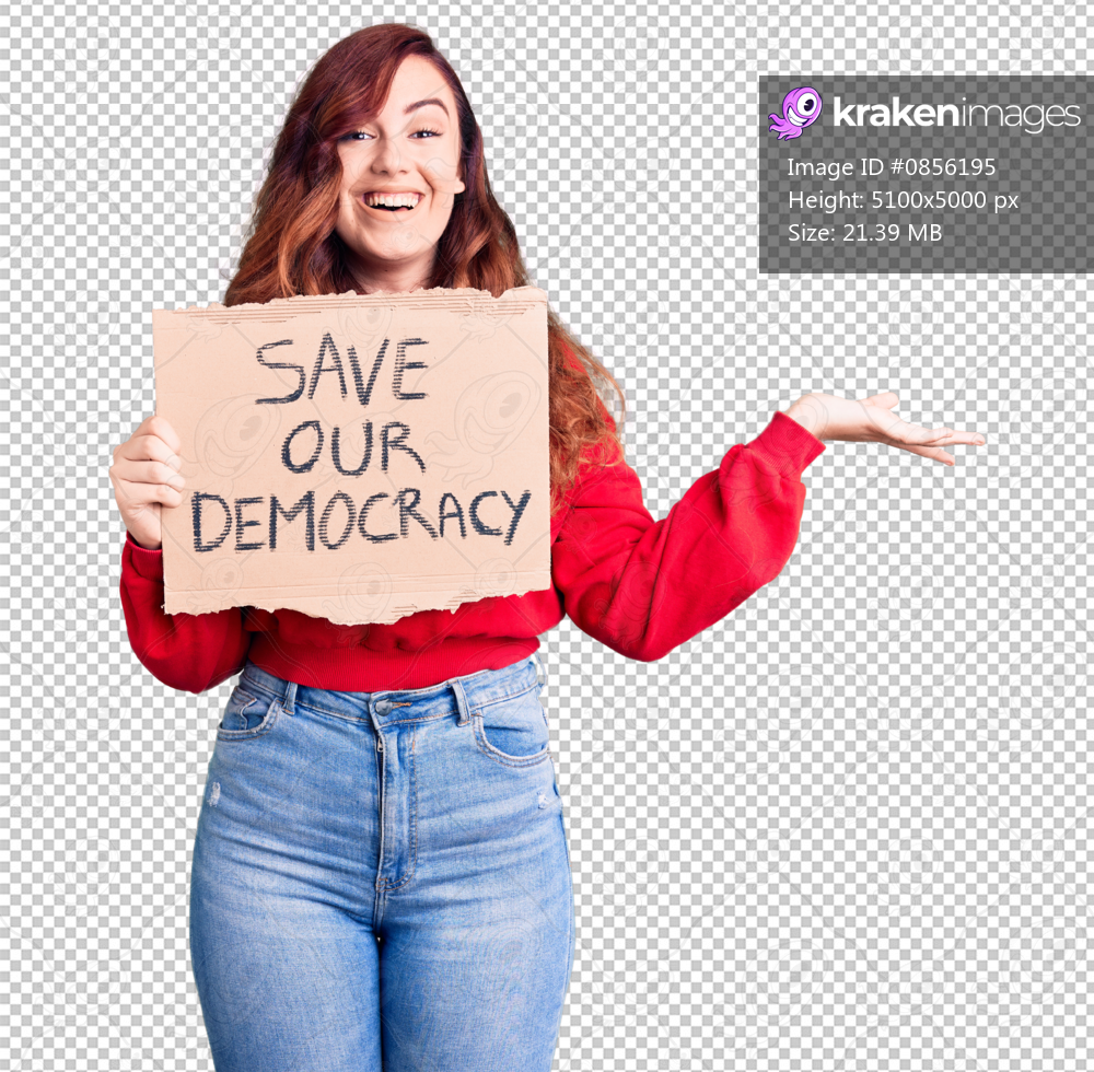 Young beautiful woman holding save our democracy protest banner celebrating victory with happy smile and winner expression with raised hands