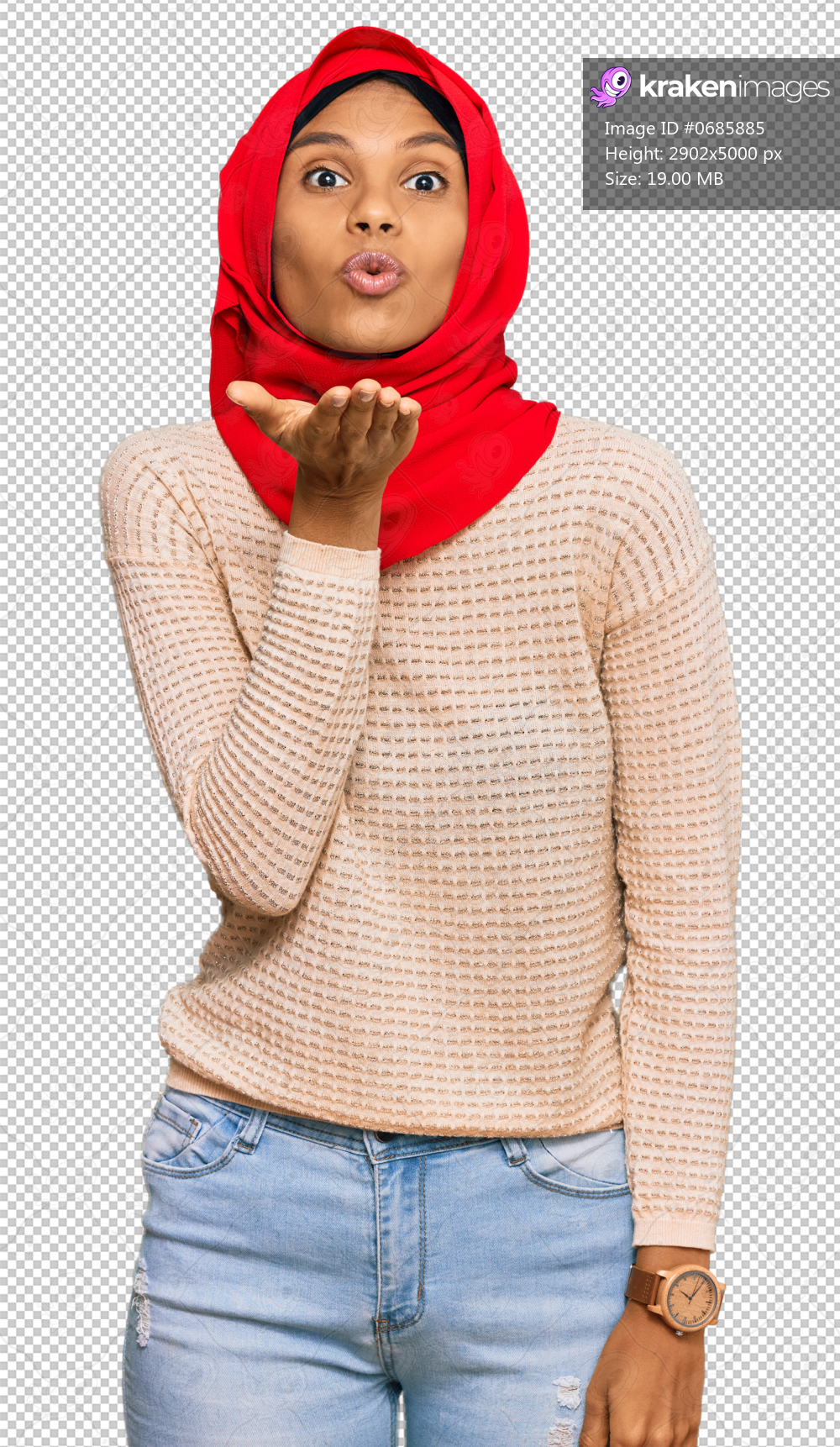 Young african american woman wearing traditional islamic hijab scarf looking at the camera blowing a kiss with hand on air being lovely and sexy. love expression.