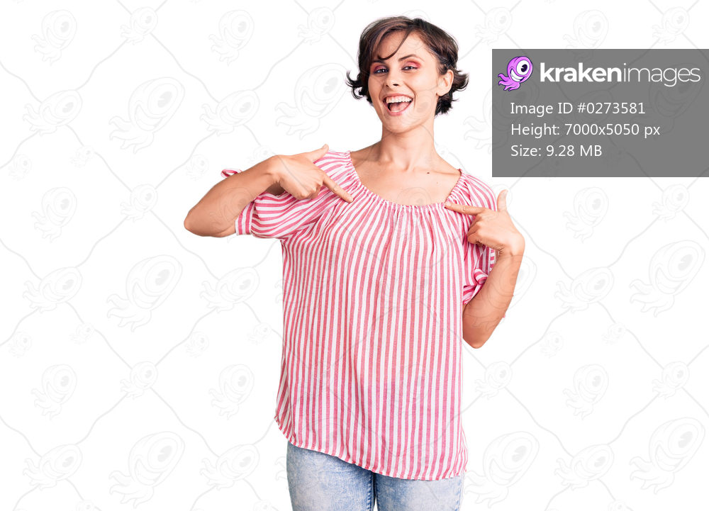 Beautiful young woman with short hair wearing casual summer clothes looking confident with smile on face, pointing oneself with fingers proud and happy. 