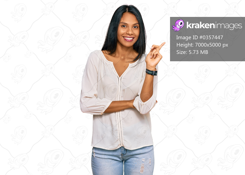 Young african american woman wearing casual clothes smiling happy pointing with hand and finger to the side 