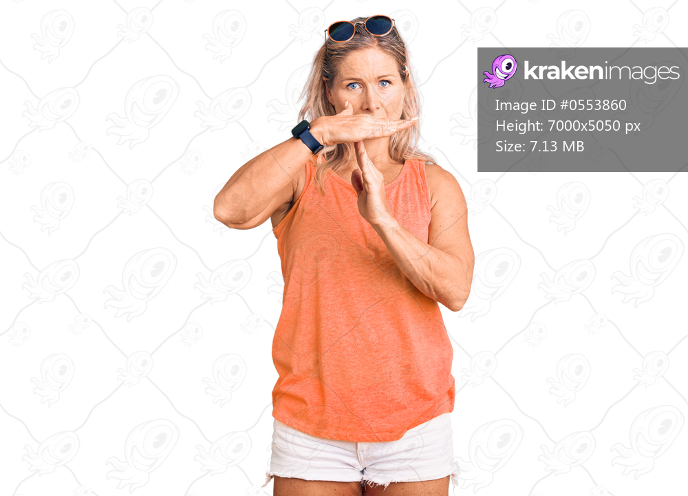 Middle age fit blonde woman wearing casual summer clothes and sunglasses doing time out gesture with hands, frustrated and serious face 