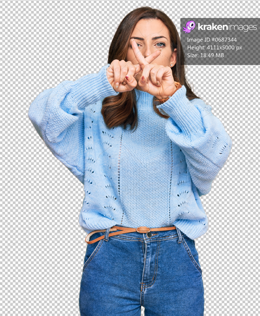 Young brunette woman wearing casual winter sweater rejection expression crossing fingers doing negative sign