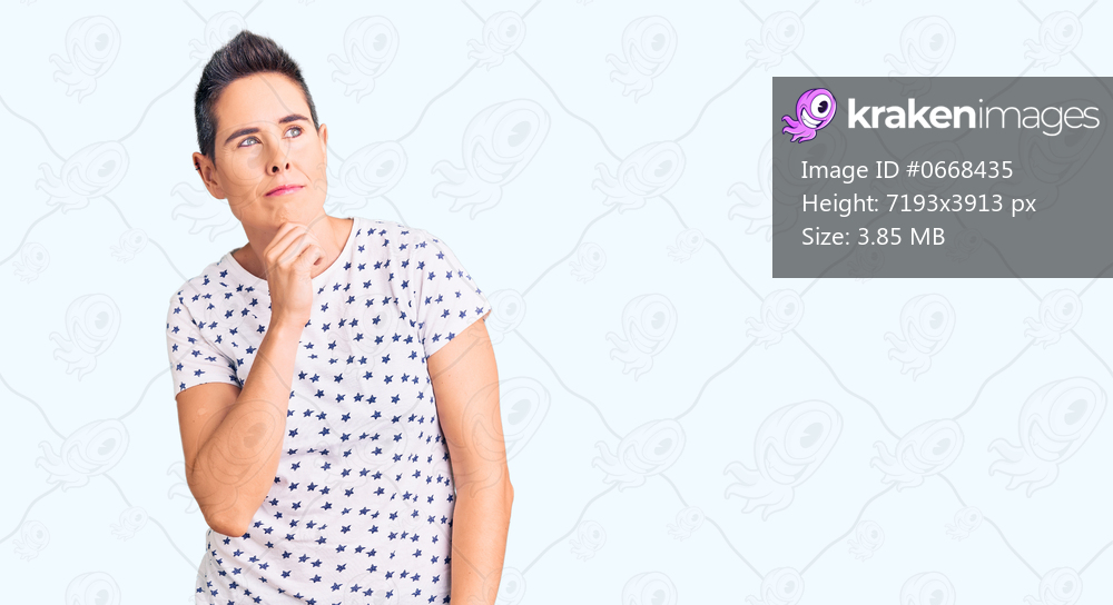 Young woman with short hair wearing casual clothes serious face thinking about question with hand on chin, thoughtful about confusing idea 