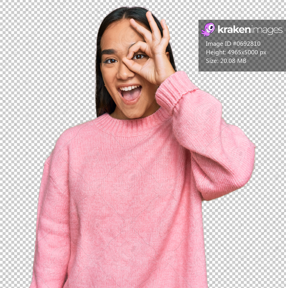 Young asian woman wearing casual winter sweater doing ok gesture with hand smiling, eye looking through fingers with happy face.