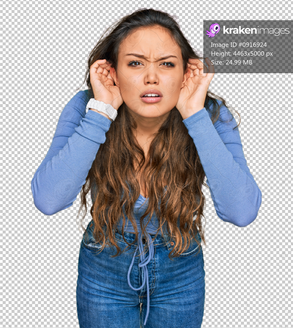 Young hispanic girl wearing casual clothes trying to hear both hands on ear gesture, curious for gossip. hearing problem, deaf