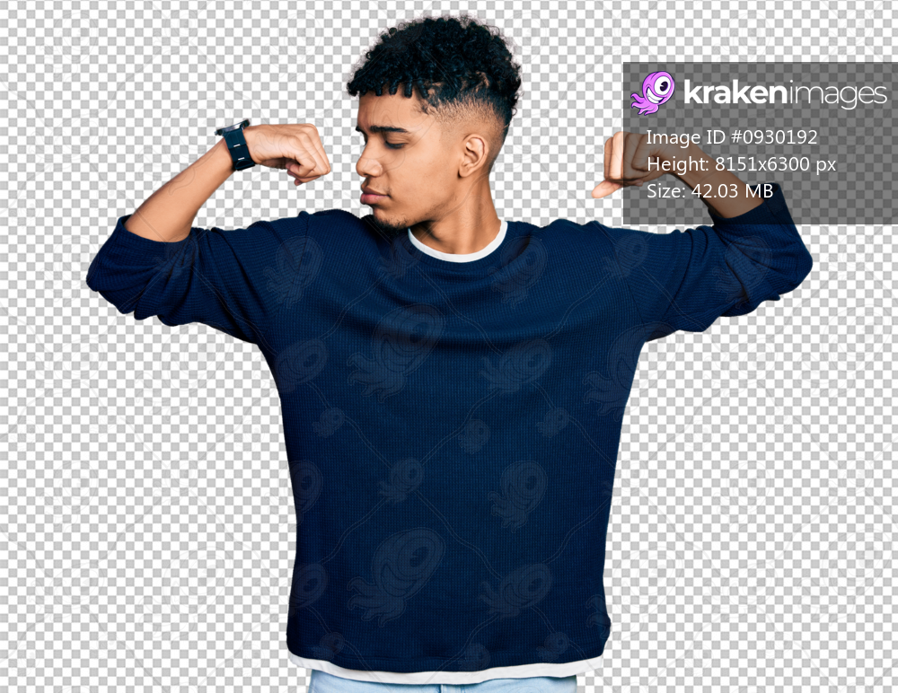 Young african american man wearing casual clothes showing arms muscles smiling proud. fitness concept.