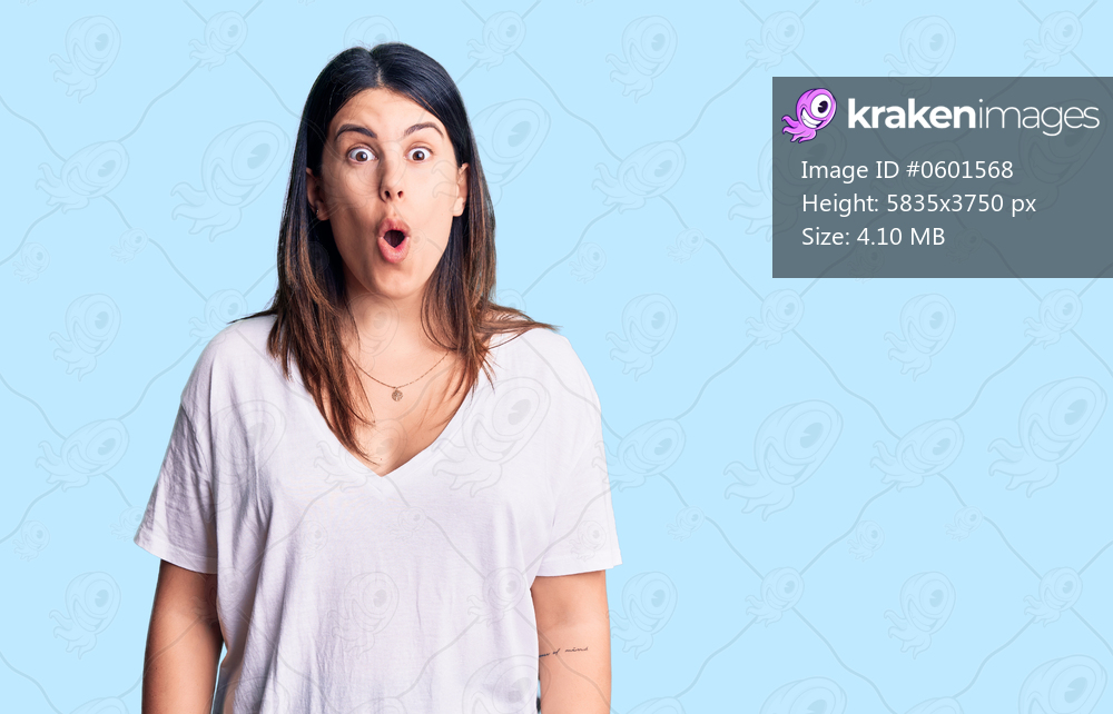 Young beautiful brunette woman wearing casual t-shirt afraid and shocked with surprise expression, fear and excited face. 