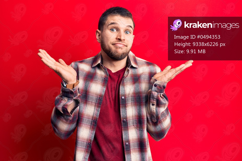 Young handsome man wearing casual shirt clueless and confused with open arms, no idea and doubtful face. 