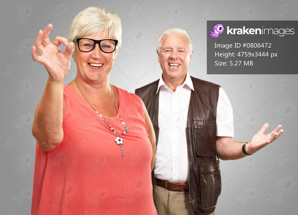 Happy Senior Couple Isolated On Gray Background