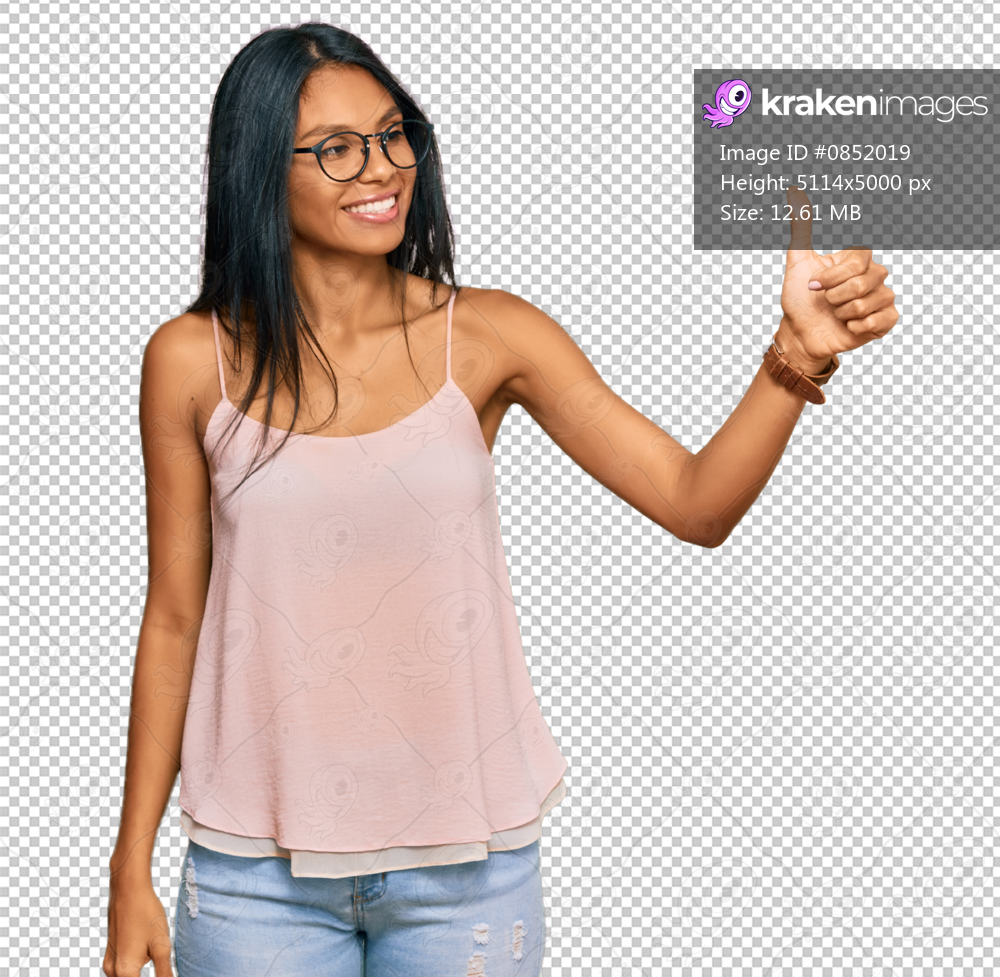 Young african american woman wearing casual clothes and glasses looking proud, smiling doing thumbs up gesture to the side