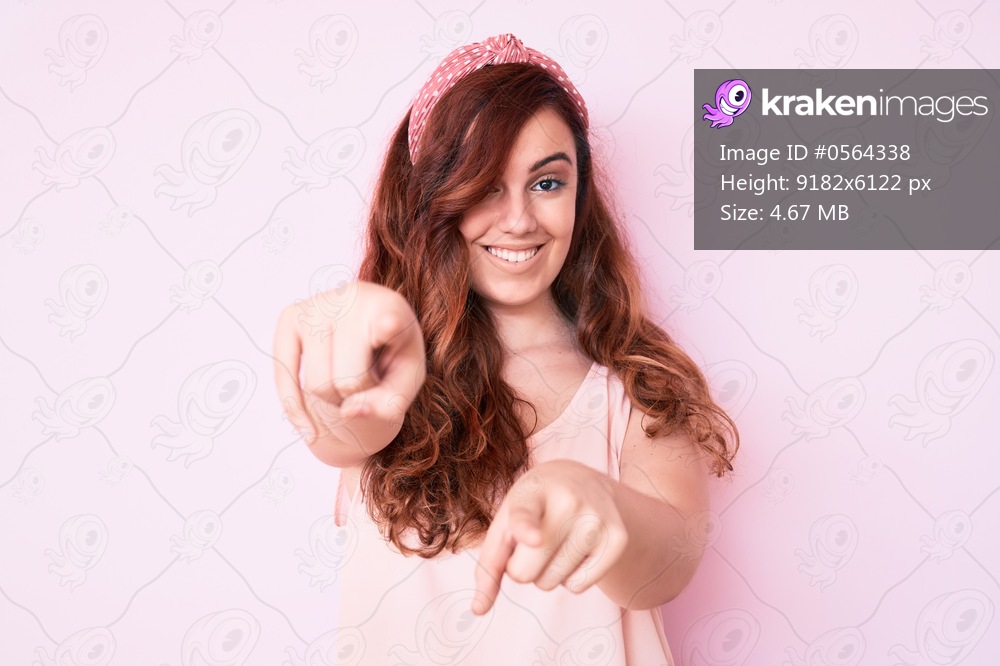 Young beautiful woman wearing casual clothes pointing to you and the camera with fingers, smiling positive and cheerful 