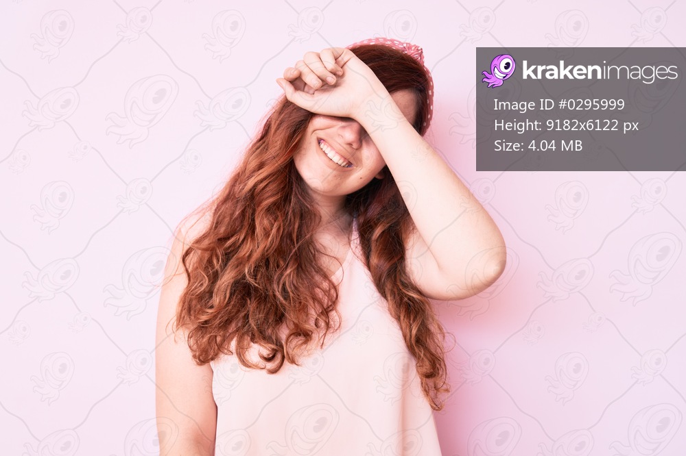Young beautiful woman wearing casual clothes covering eyes with arm smiling cheerful and funny. blind concept. 