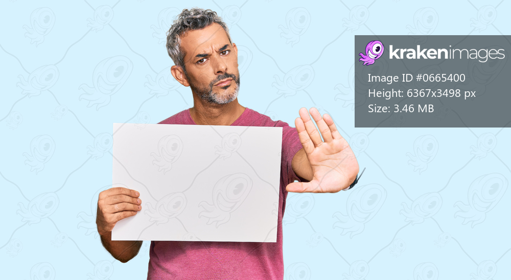 Middle age grey-haired man holding blank empty banner with open hand doing stop sign with serious and confident expression, defense gesture 