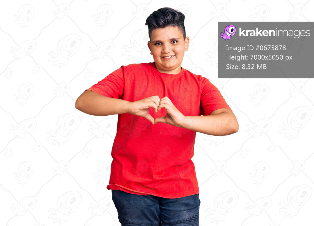 Little boy kid wearing casual clothes smiling in love showing heart symbol and shape with hands. romantic concept. 